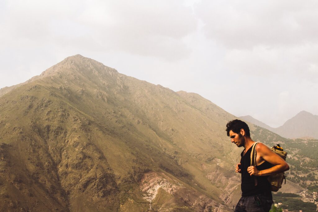 a man hiking through the mountains
